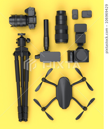 Top view of monochrome designer workspace and photography gear on yellow 106969429