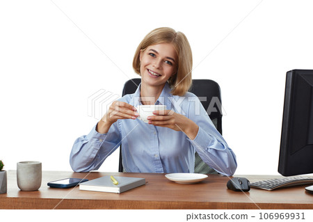 blonde businesswoman using PC computer, drinking coffee 106969931