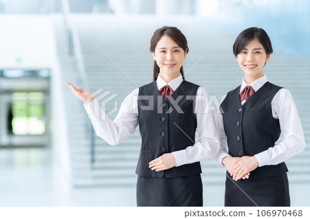 A young receptionist guiding you in the lobby A young receptionist guiding you in the lobby 106970468