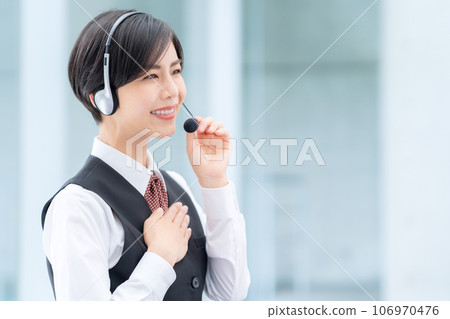 Young female operator working at a call center Young female operator working at a call center 106970476
