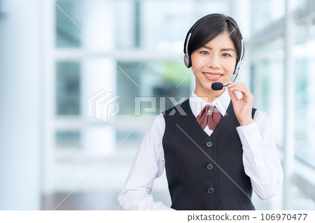Young female operator working at a call center Young female operator working at a call center 106970477