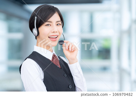 Young female operator working at a call center Young female operator working at a call center 106970482