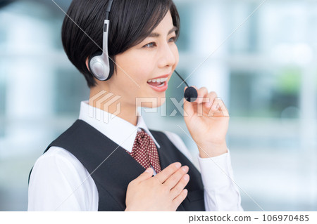 Young female operator working at a call center Young female operator working at a call center 106970485