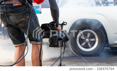 Close up Professional videographer on event, videographer filmmaker cinematographer camera, Filmmaking, videography. Close up Professional videographer on event, videographer filmmaker cinematographer camera, Filmmaking, videography. 106970784