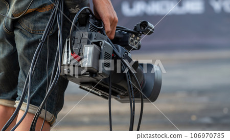 Close up Professional videographer on event, videographer filmmaker cinematographer camera, Filmmaking, videography. 106970785