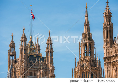 Big Ben, Westminster Bridge on River Thames in London, the UK. English symbol. Lovely puffy clouds, sunny day 106972009
