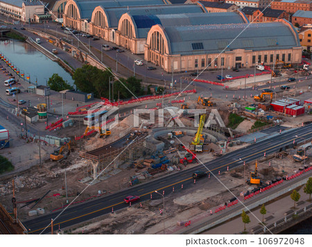 Building Rail Baltica project in the cenetr of Riga. Construction works of roads, railway and bridges in Riga. Building Rail Baltica project in the cenetr of Riga. Construction works of roads, railway and bridges in Riga. 106972048