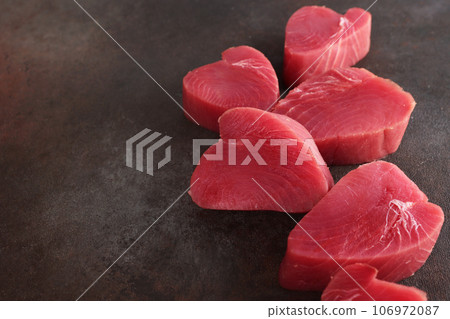 Large chunks of tuna steak. Fresh tuna. Healthy food. Natural omega. Selective focus.Copy space. Large chunks of tuna steak. Fresh tuna. Healthy food. Natural omega. Selective focus.Copy space. 106972087
