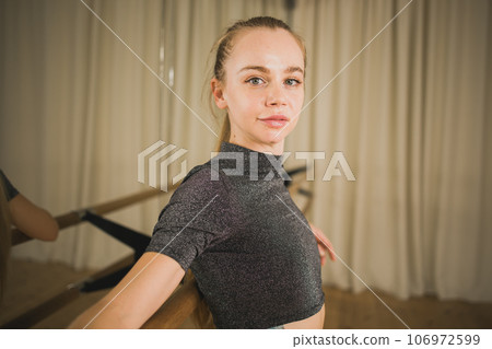 Active young woman portrait female ballet or contemporary dance teacher class in studio - copy space and empty place for text Active young woman portrait female ballet or contemporary dance teacher class in studio - copy space and empty place for text 106972599