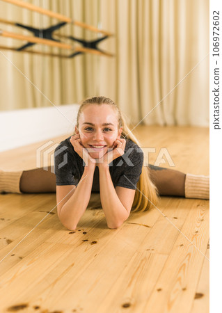 Active young woman portrait female ballet or contemporary dance teacher class in studio 106972602