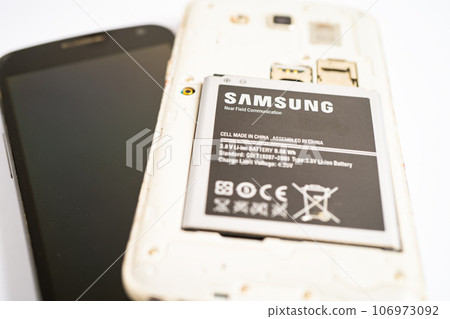 BANGKOK,THAILAND. MAY 1 2023 technician repairing and insert battery for Smartphone SAMSUNG. BANGKOK,THAILAND. MAY 1 2023 technician repairing and insert battery for Smartphone SAMSUNG. 106973092