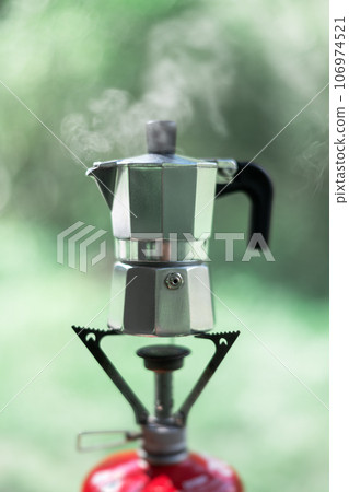Making coffee outdoors on gas camping fire Making coffee outdoors on gas camping fire 106974521
