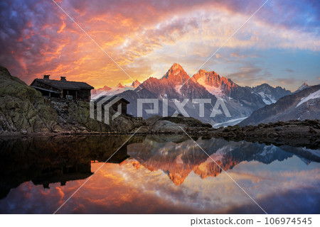 Wooden cabin on Lac Blanc lake in French Alps Wooden cabin on Lac Blanc lake in French Alps 106974545