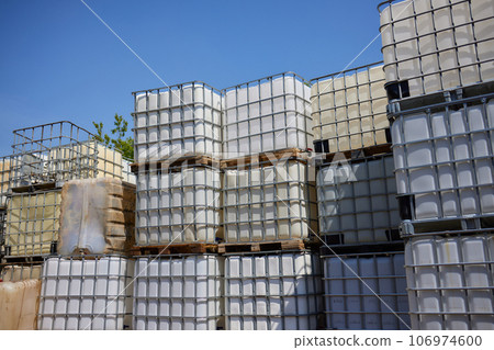 blue plastic barrel where the empty oil is stacked. blue plastic barrel where the empty oil is stacked. 106974600