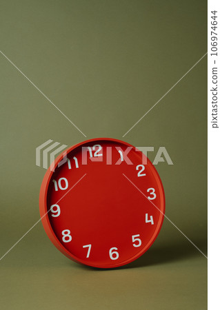 red clock without hour or minute hands red clock without hour or minute hands 106974644