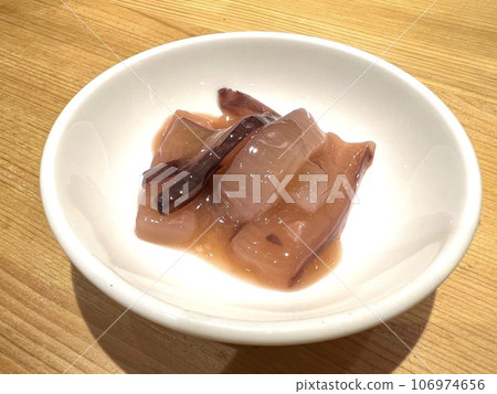Salted squid in a small white plate 106974656