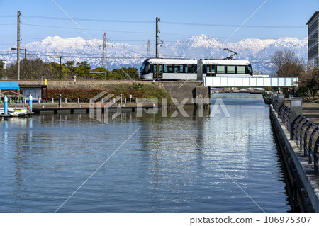 Toyama Local Railway Toyama Port Line tram crossing Iwase Canal 106975307