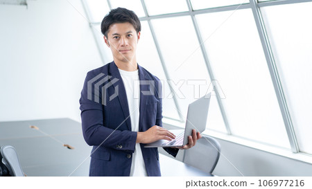 Businessman using a personal computer 106977216