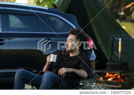 Japanese man relaxing at a campsite - Image of outdoor auto camping and solo camping Japanese man relaxing at a campsite - Image of outdoor auto camping and solo camping 106977226