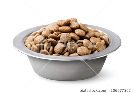 Dry cat food in a bowl close-up on a white background. 106977562