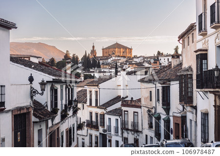 Views of the medieval village of Ronda with white Andalusian houses and the gothic style church of Santuario de Mar a Auxiliadora. Malaga, Spain 106978487