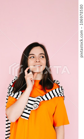 Captivating Daydreamer: Enchanting Woman with Finger in Mouth, Lost in Thought, Gazing into Empty Captivating Daydreamer: Enchanting Woman with Finger in Mouth, Lost in Thought, Gazing into Empty 106978580