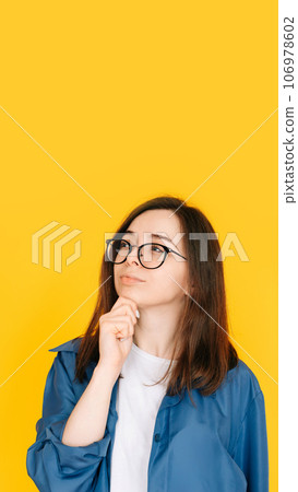 Smart Shopping Decision: Stylish and Thoughtful Woman Considering New Product Purchase, Arm on Face Smart Shopping Decision: Stylish and Thoughtful Woman Considering New Product Purchase, Arm on Face 106978602