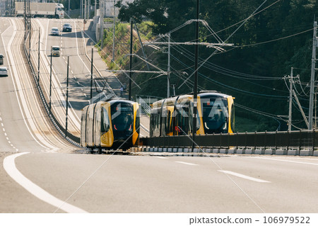 Utsunomiya light rail going up the hill 106979522