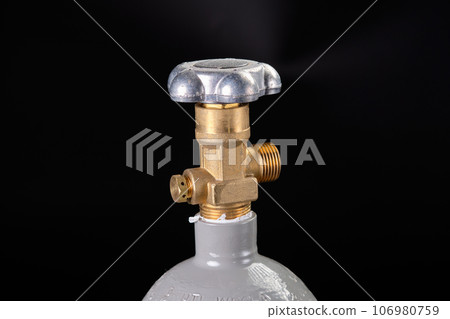 CO2 regulator control of gas output on a black background 106980759
