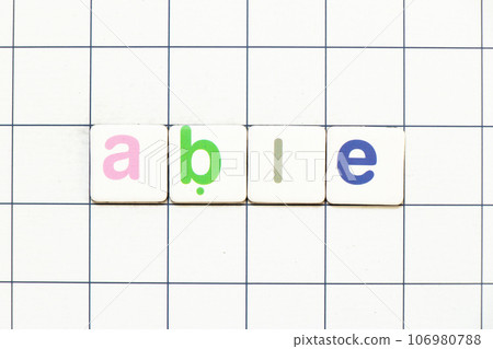 Colorful tile letter in word able on white grid background 106980788