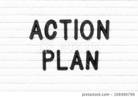 Black color letter in word action plan on white felt board background 106980790