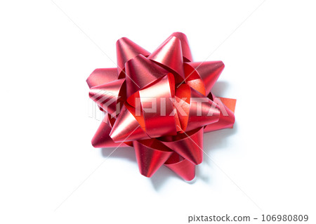 Ribbon bow banner in red color on white paper background Ribbon bow banner in red color on white paper background 106980809