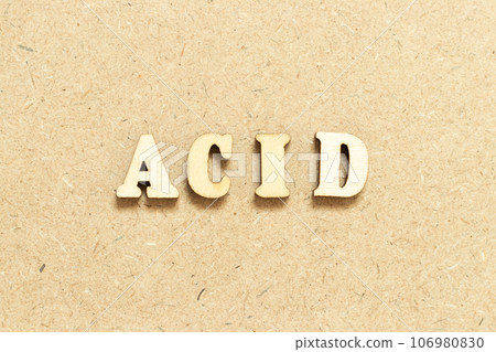 Alphabet letter in word acid on wood background Alphabet letter in word acid on wood background 106980830