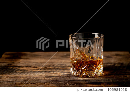 Whiskey with ice in glasses Whiskey with ice in glasses 106981938