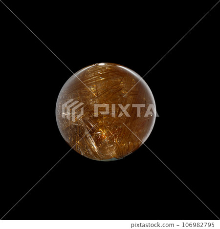 Ball of quartz with rutile on a black background 106982795