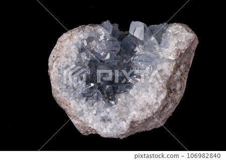 Celestine mineral stone macro on microcline on black background Celestine mineral stone macro on microcline on black background 106982840