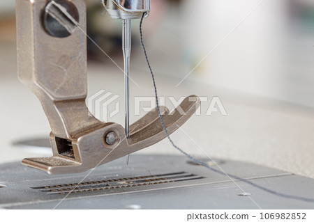 Sewing machine needle with thread and fabric Sewing machine needle with thread and fabric 106982852