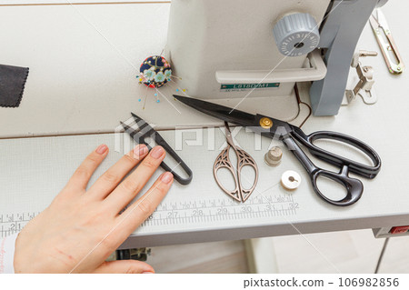 Sewing machine with sewing tools, scissors, threads Sewing machine with sewing tools, scissors, threads 106982856
