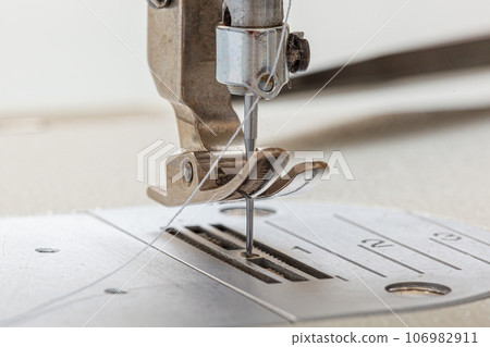 Sewing machine needle with thread and fabric Sewing machine needle with thread and fabric 106982911