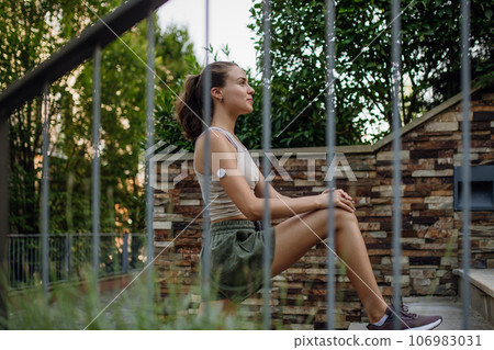 Beautiful diabetic woman preparing for outdoor workout in the city. Beautiful diabetic woman preparing for outdoor workout in the city. 106983031