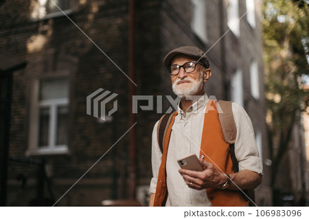 Senior tourist exploring a new city and visiting interesting sites. Senior tourist exploring a new city and visiting interesting sites. 106983096