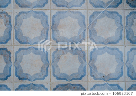 Close-up of vintage tiles with a white-blue pattern. Close-up of vintage tiles with a white-blue pattern. 106983167