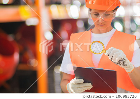 Woman builder is looking for problems in the estimate. Woman builder is looking for problems in the estimate. 106983726