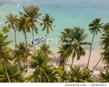 Tropical island of Koh Kood in Thailand. An exotic sunny beach with crystal clear waters. Tropical island of Koh Kood in Thailand. An exotic sunny beach with crystal clear waters. 106984014