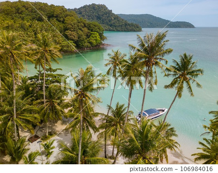 Tropical island of Koh Kood in Thailand. An exotic sunny beach with crystal clear waters. Tropical island of Koh Kood in Thailand. An exotic sunny beach with crystal clear waters. 106984016