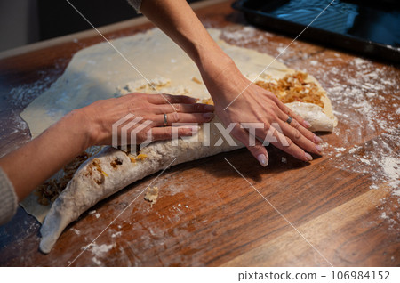 Closeup view of preparing a strudel Closeup view of preparing a strudel 106984152