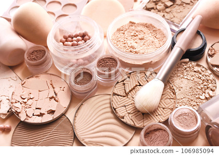 Varieties of face powders and foundations for perfect complexion, basic make up products to even out and matte skin, beauty cosmetics with brushes and sponges, selective focus, toned image 106985094