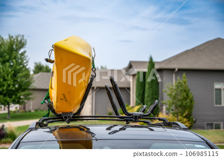 Roof mounted kayak on top of a van for transportation  106985115