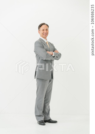 Business male profile white background arms folded 106986235