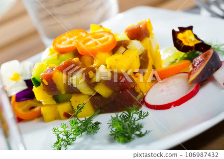 Tasty tartar with fresh tuna, mango, avocado 106987432